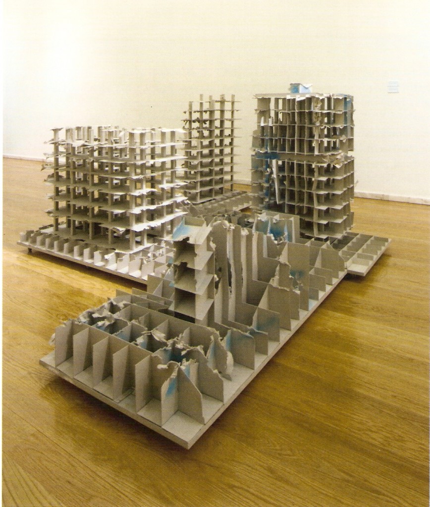 Instalação composta por quatro esculturas (madeira e cartão)